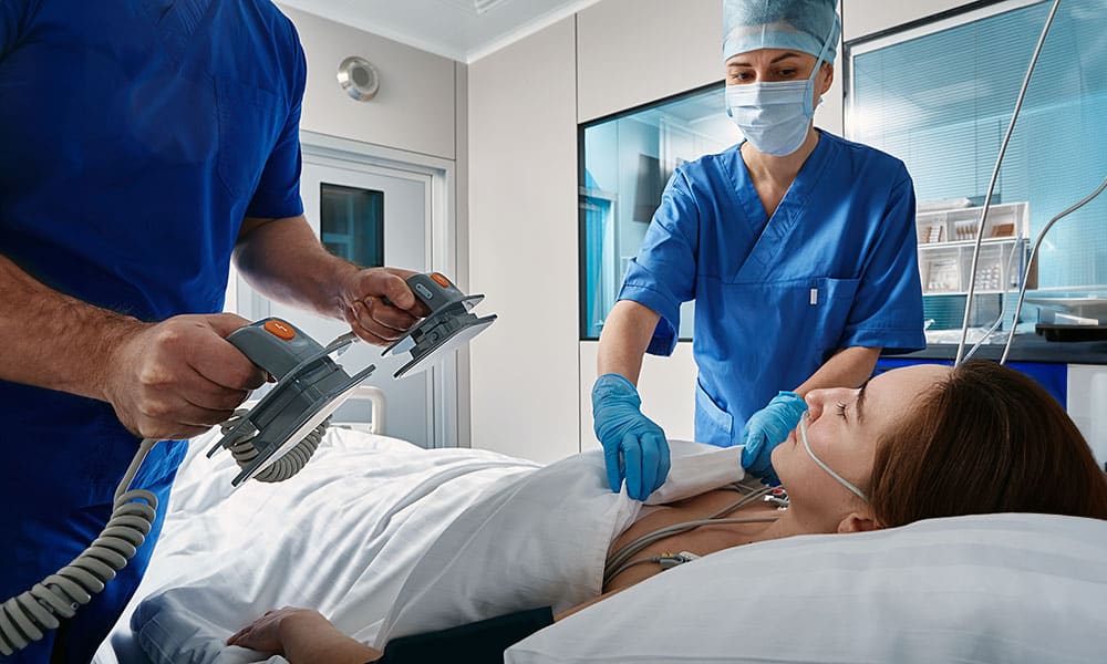 Health staff attempting to resuscitate patient
