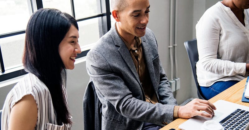 Group of professionals in discussion at an office table