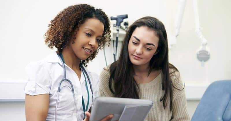 Mental health nurse with patient